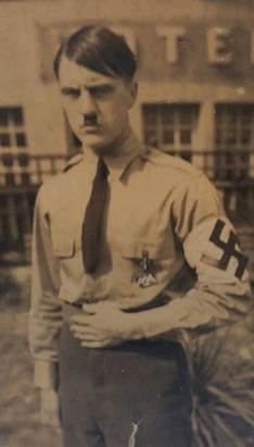 A person in uniform with a mustache

AI-generated content may be incorrect.